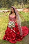 Bride in a red wedding dress in a meadow in Yosemite National Park.