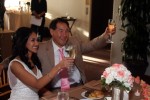 Bride and Groom raising glasses in a toast