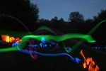 Game of Tag In the Dark. Kids with Glow Sticks Long Exposure 1