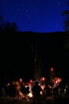 Friends sit at Campfire. Night Shot, Long Exposure