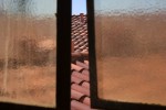 Red Tile Roof Through Window 2