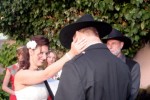 Shot During Wedding Ceremony, Bride Touch Grooms Neck