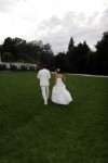 Bride and Groom Depart up grassy hill wedding reception Hahn Estates in Soledad