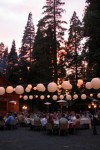Gowing lanterns, redwoods, sunset. Wedding reception wedding Evergreen Lodge in Goveland, CA