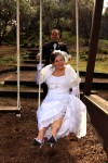 Groom pushes bride on swing Chateau Du Sureau and Erna's Elderberry House wedding photos