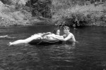 Boyfriend and Girlfriend in water. Infrared photography of the Big Sur River on the summer solstice.