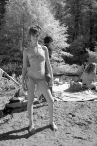 Teen girl poses. Infrared photography of the Big Sur River on the summer solstice.