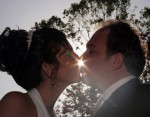 Bride and groom kiss. starburt of Light. Los Gatos Hotel and Spa wedding reception