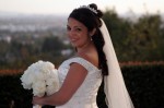 Bride looking over shoulder, staniding on a hill nice winter light southern California summit House fullerton CA