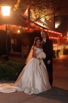 bride and groom In front of Summit House decorated for Christmas fullerton CA