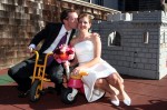 Bride and groom goof off on the toys at the daycare behind St. Gregory's of Nyssa Episcopal Church