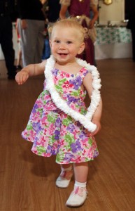 1 year old girl dancing at a 60th birthday party in San Diego California
