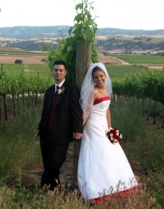 Bride and groom in grape orchard. Rios-Lovell Winery in Livermore CA