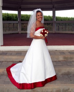 Bride on Gazebo steps Rios-Lovell Winery in Livermore CA white dress red trim.