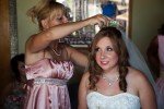 maid of honor putting veil on bride at a wedding at heather farms in walnut creek