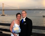 Bride and groom evening light bay bridge pier 1 rainbow san francisco CA