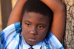 environmental portrat of an African American boy, Oakland, CA