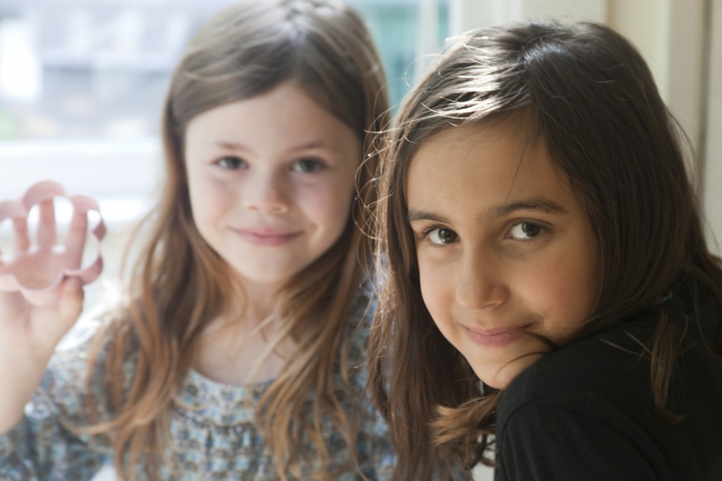 beautiful young girls looking at camera, smiling. Children, portraits