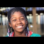 Proud and happy young african american girl in Oakland California