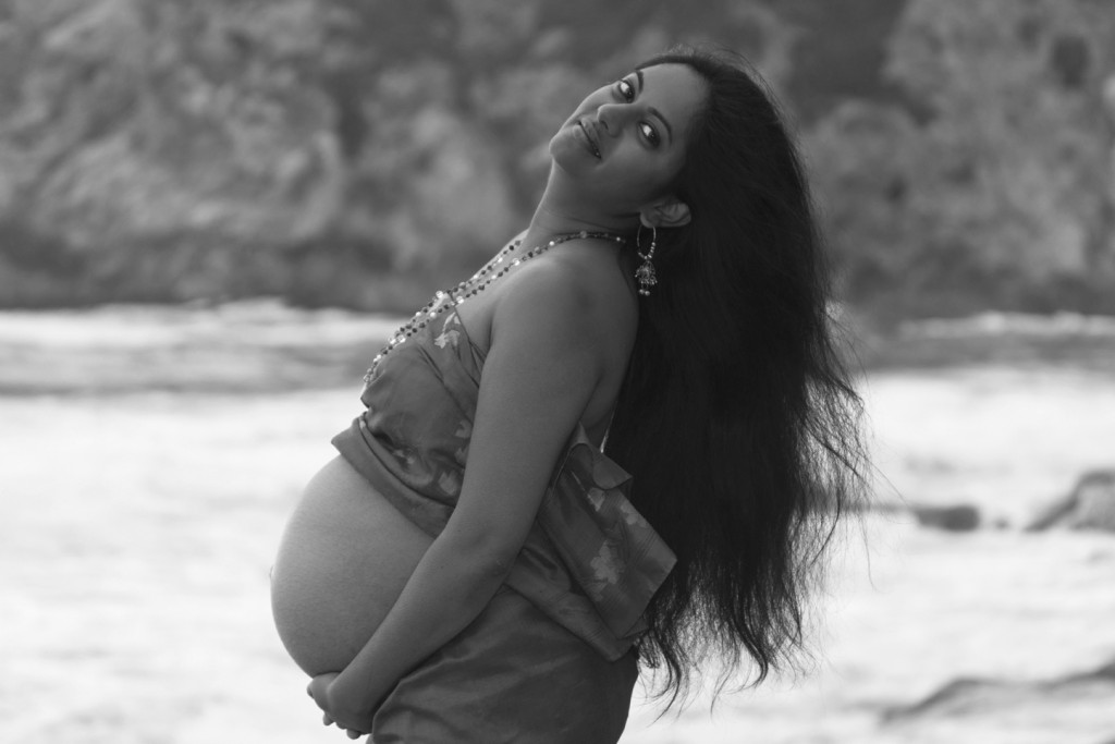 Pregnant Indian woman on a beach in Pacifica California