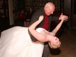 dad dips bride, dancing at a wedding reception in the Ahwahnee