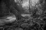 Long exposure black and white shot of the arroyo seco river in the Los Pagres National Forest