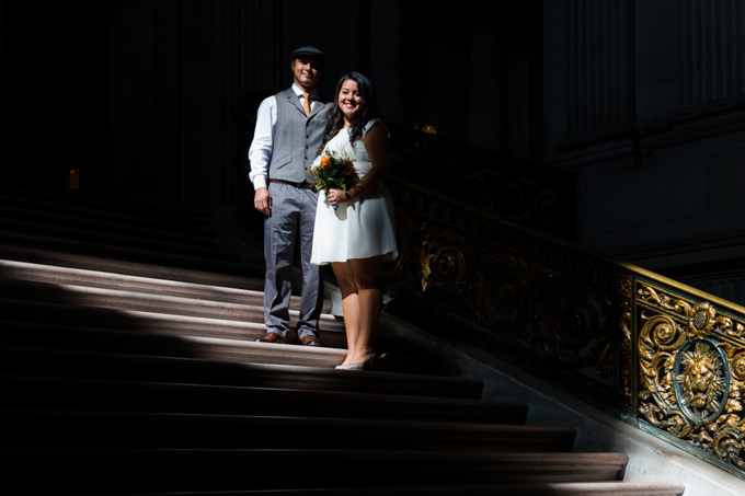 Bride and groom on the steps of San Francisco City Hall