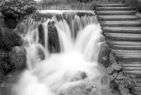 Waterfalls and stairs in black and white. Plitvica National Park in Croatia